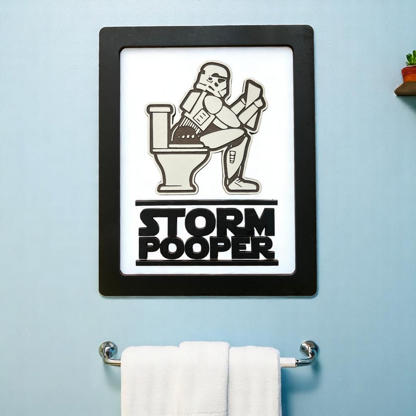Embrace your inner Jedi—or Sith—with our whimsically powerful Storm Pooper Bathroom Sign. Crafted from three layers of 1/8-inch wood, this sign is not only a conversation starter but a work of art! Its built-in hanger ensures it lays flat against your wall, making it a seamless addition to your bathroom decor. Whether you're a fan of the dark side or simply want to add a touch of the Force to your space, this sign is the perfect blend of fun and function.