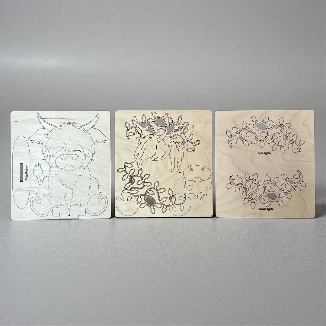 Three wooden panels with line drawings of a creature and abstract patterns against a gray background.