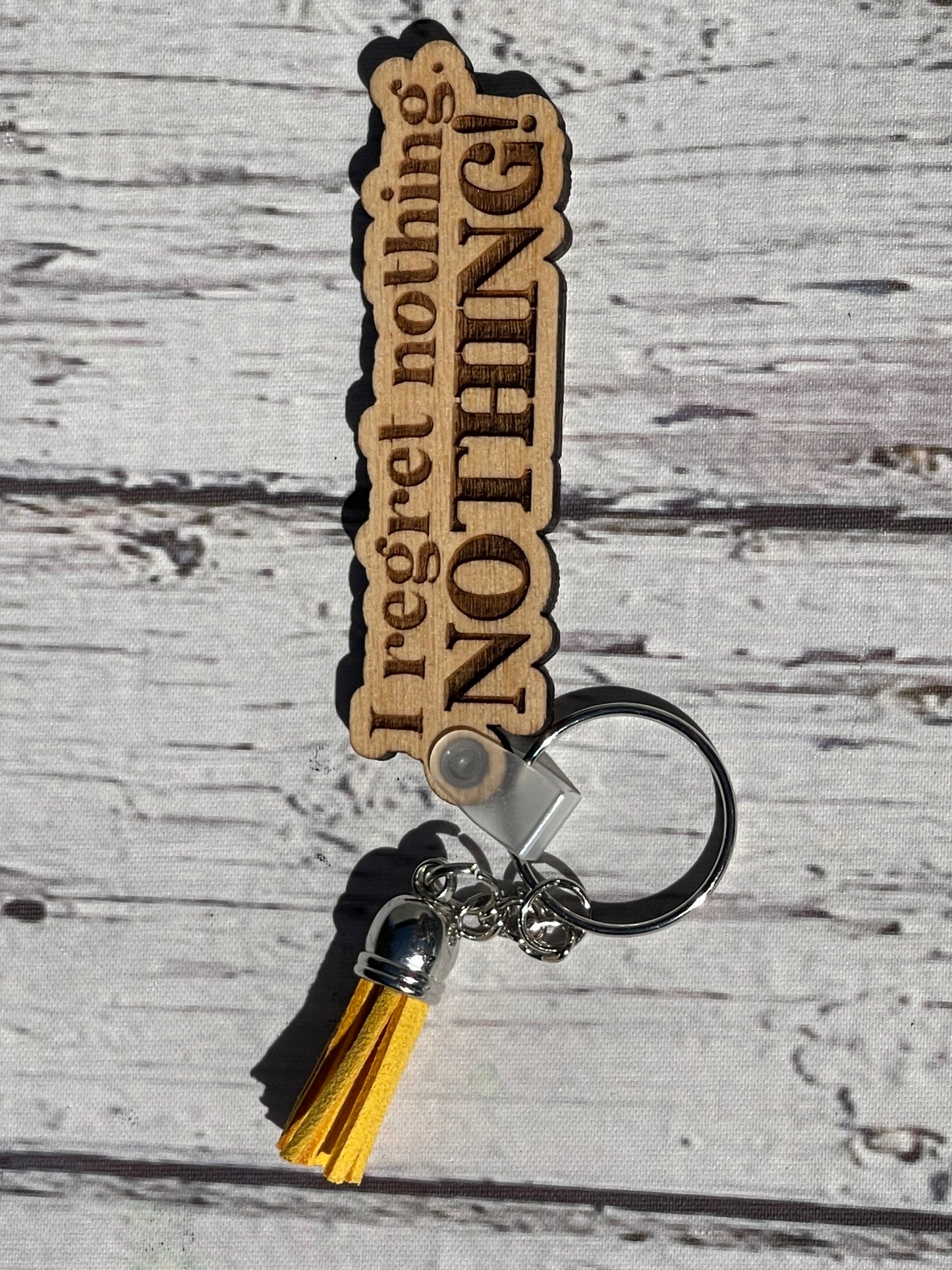 Regret NOTHING keychain
