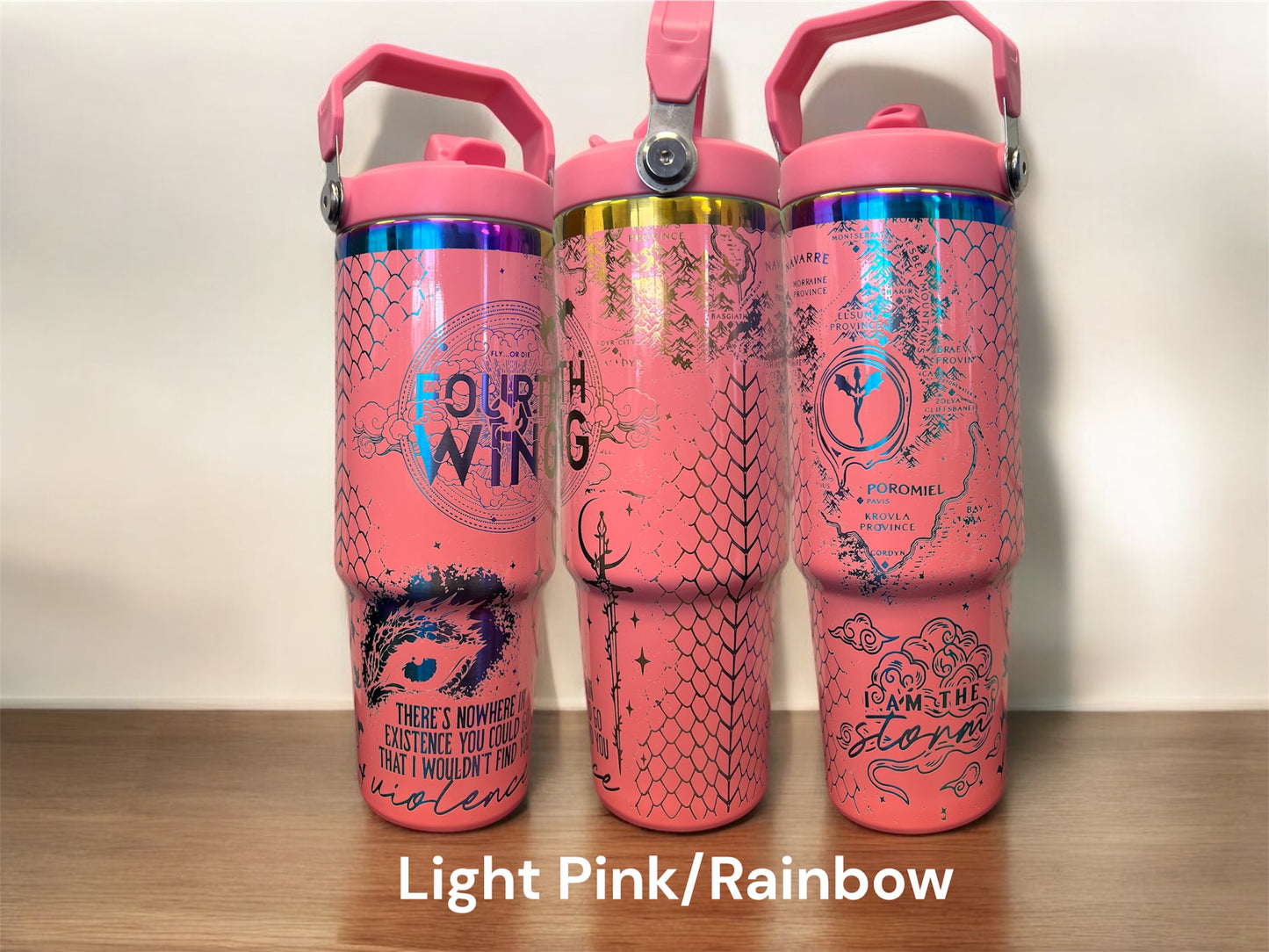 30oz Fourth Wing I am the Storm fantasy romance dragon rider engraved tumbler. Light pink powder coating with rainbow engraving. 