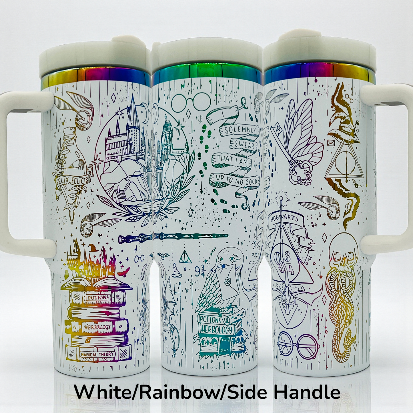 White mugs with rainbow lids, featuring intricate black magical-themed illustrations and symbols.