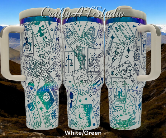 40oz tarot card themed laser engraved tumbler. White powder coating with green engraving. Sage, butterflies, moths, stars, crystals. Trio with background