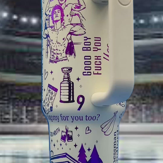 White travel mug with purple illustrations of flexing figures, trees, and a trophy, on ice rink.