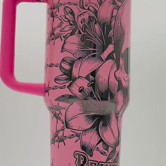 40oz Beautiful Disaster skull with lilies and barb wire laser engraved tumbler. Black engraving with Light Pink top  color