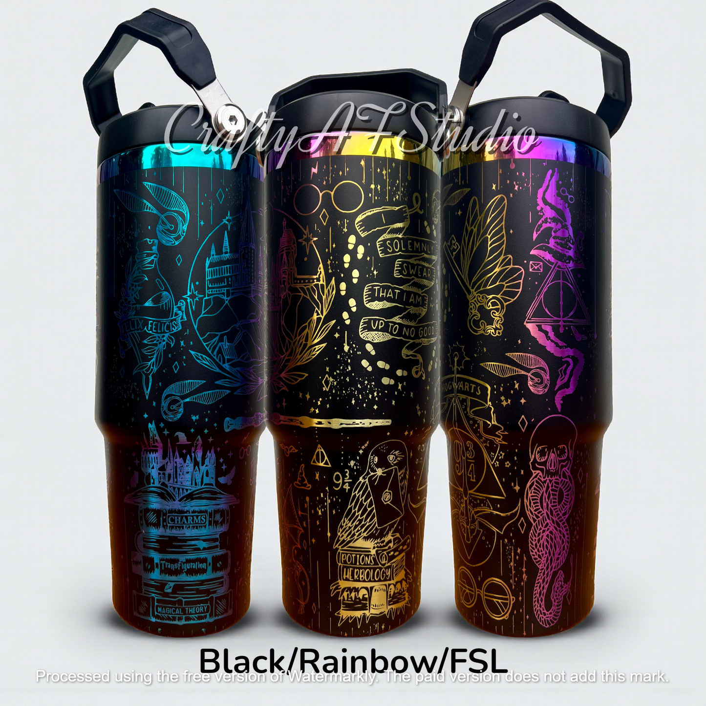 Three black tumblers with rainbow designs featuring magical symbols and illustrations.