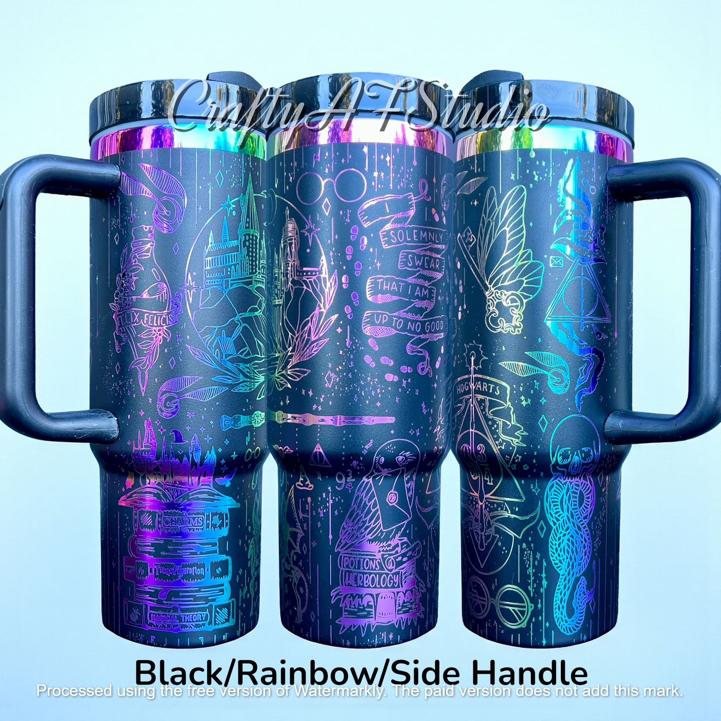 Black travel mugs with rainbow holographic magical designs, including castles and symbols.
