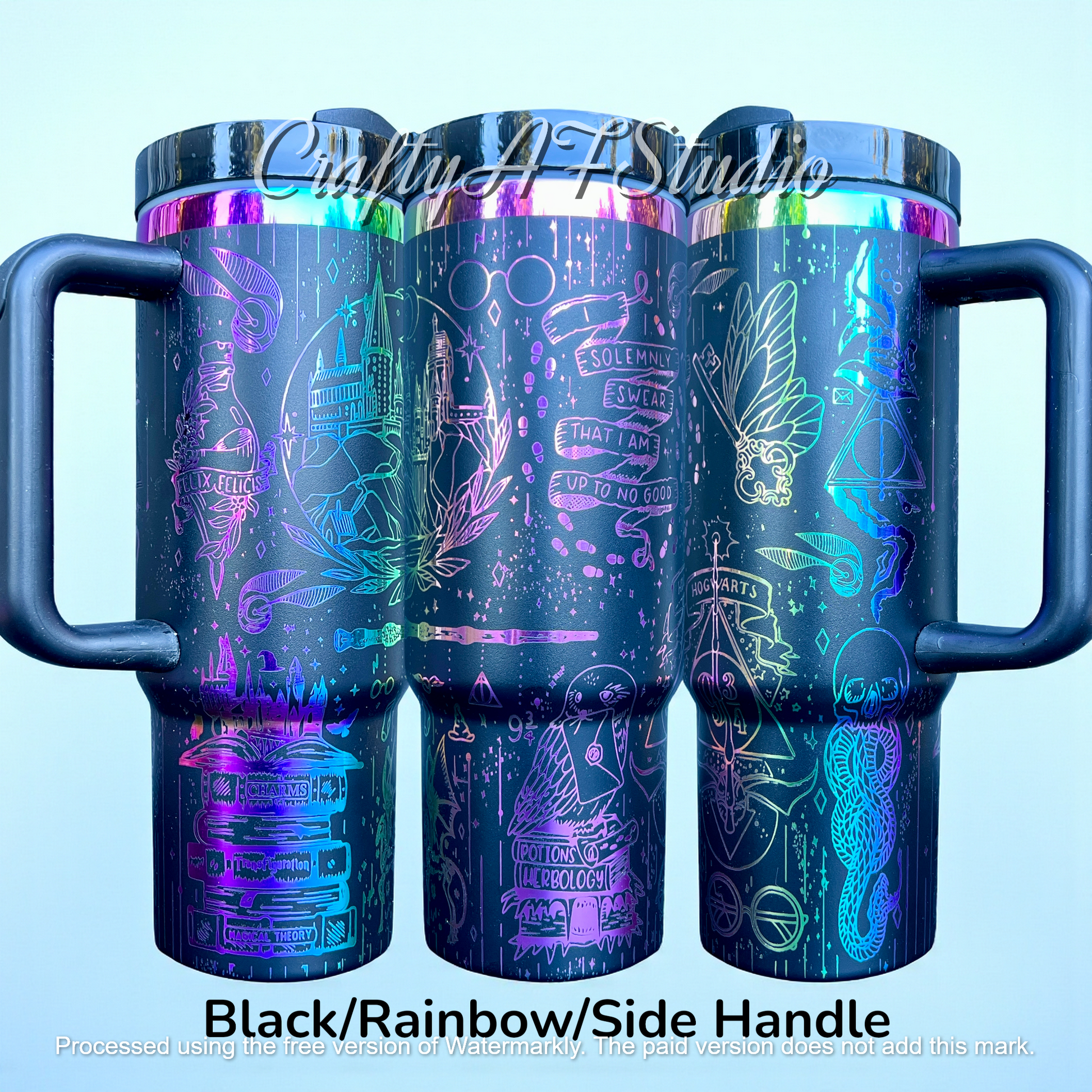 Black travel mugs with rainbow holographic magical designs, including castles and symbols.